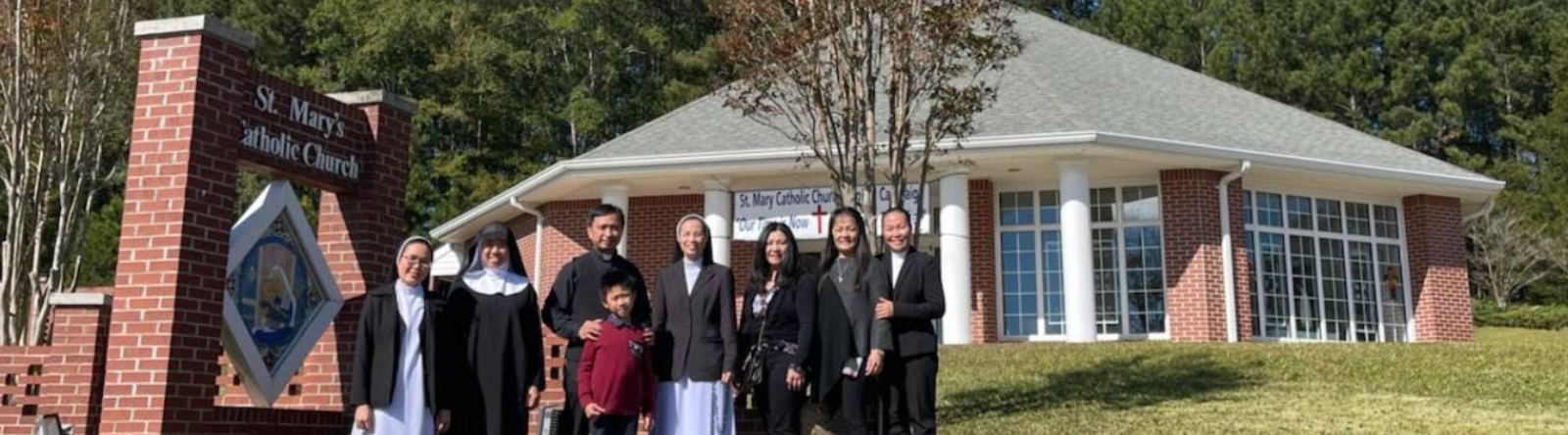 people standing in front of church outside