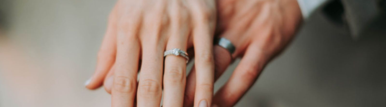 hands with wedding rings on