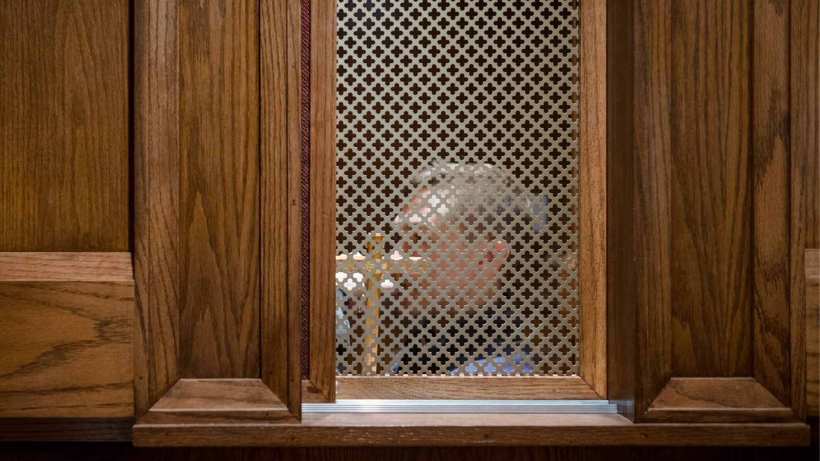 priest in confessional