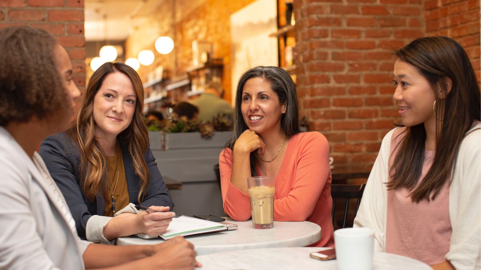 women sitting around a table